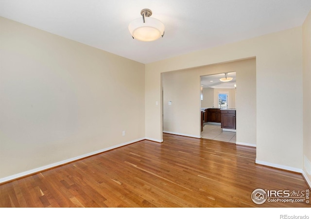 spare room with light hardwood / wood-style floors