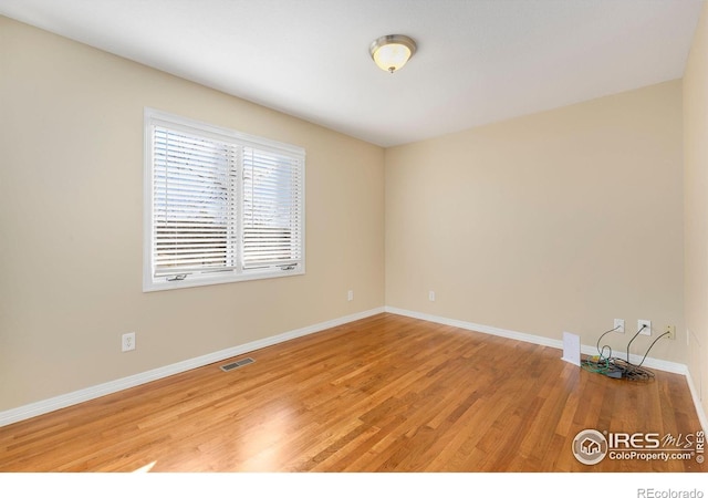 empty room featuring wood-type flooring