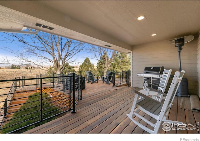 wooden terrace with grilling area