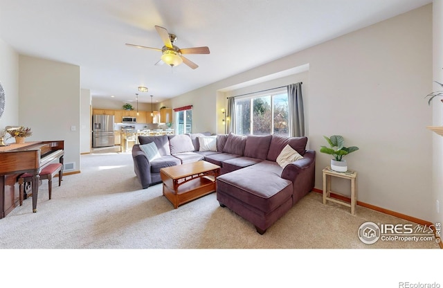 living room featuring ceiling fan and light colored carpet