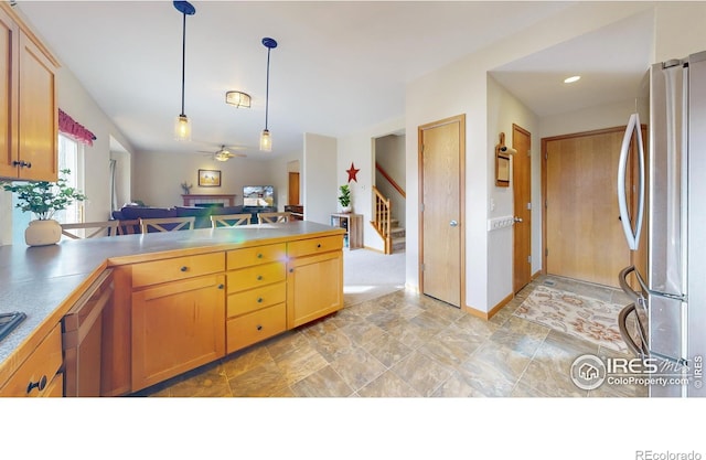 kitchen featuring hanging light fixtures, ceiling fan, and appliances with stainless steel finishes