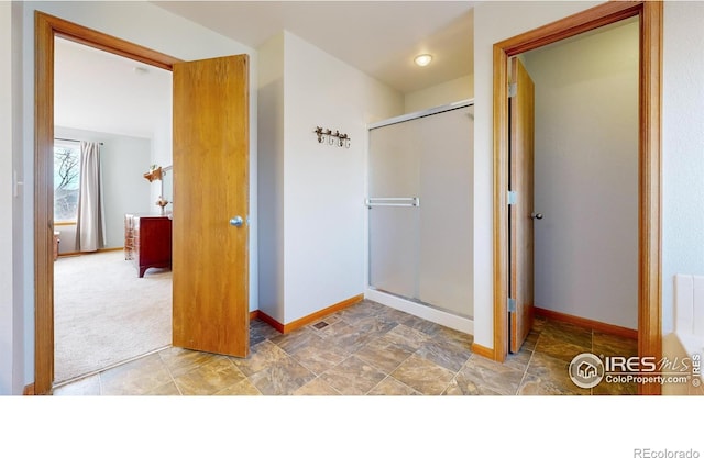 bathroom featuring an enclosed shower