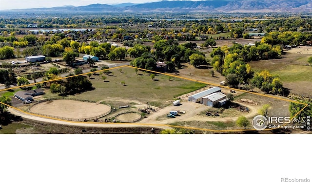 birds eye view of property featuring a mountain view