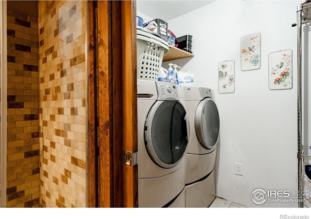 laundry area featuring laundry area and washing machine and clothes dryer