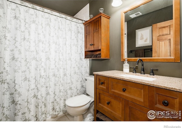 bathroom with toilet, curtained shower, vanity, and visible vents