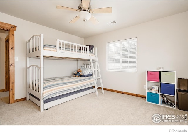 bedroom featuring carpet, visible vents, and baseboards