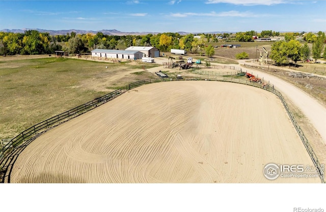 aerial view featuring a rural view and a mountain view