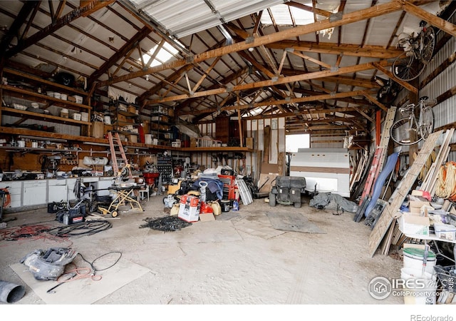 garage with metal wall and a workshop area