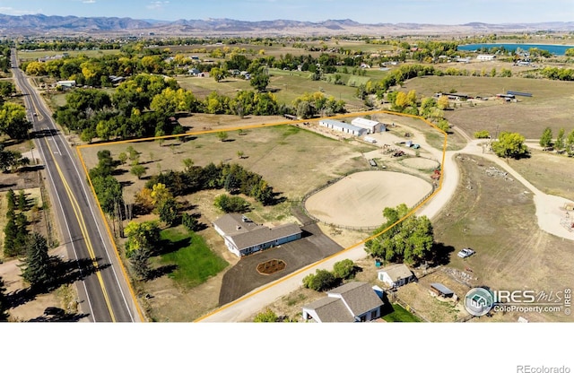 birds eye view of property featuring a water and mountain view