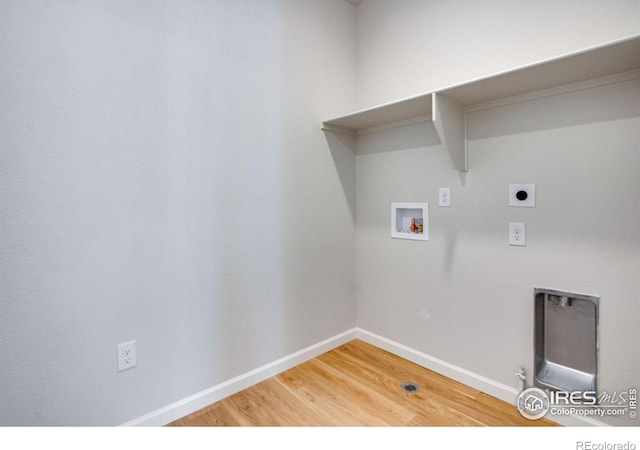 laundry room featuring hookup for a gas dryer, wood-type flooring, hookup for an electric dryer, and washer hookup