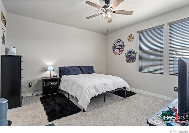 bedroom with light carpet and ceiling fan