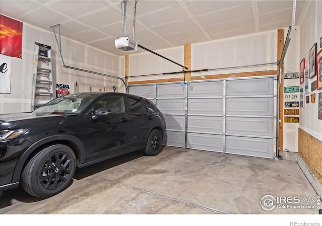 garage featuring a garage door opener