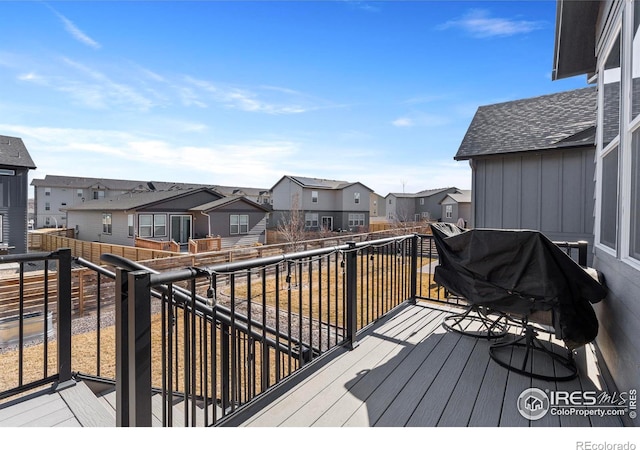 wooden terrace featuring a grill