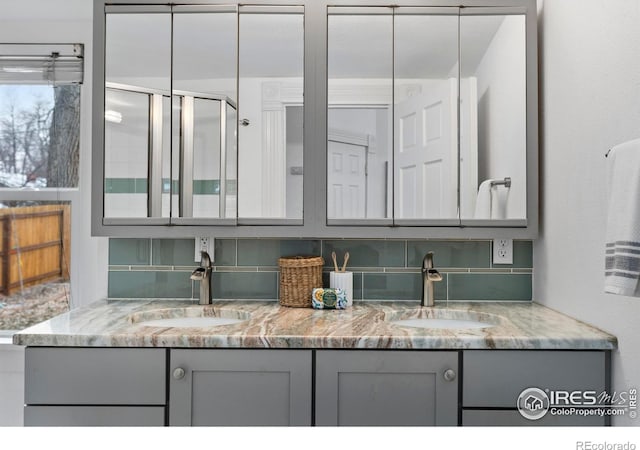 bathroom with vanity and backsplash