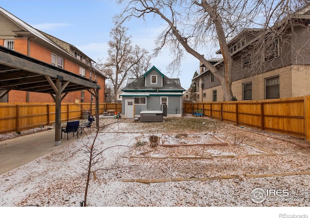 exterior space featuring a hot tub and a patio area