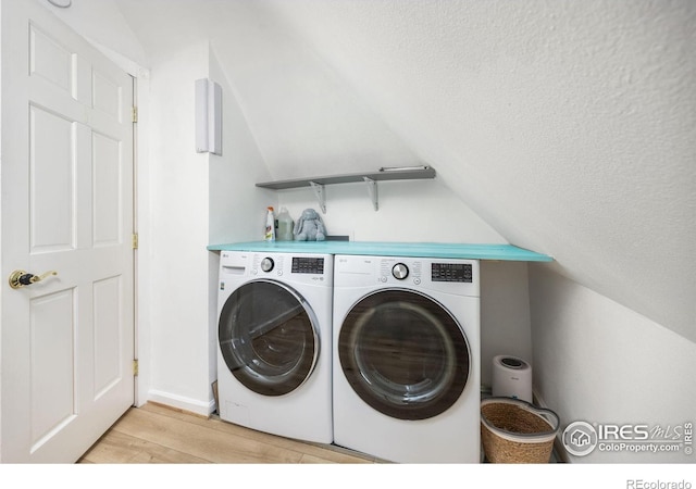 718 Remington St, Fort Collins, CO 80524 - laundry room with baseboards, light wood-style floors, laundry area, a textured ceiling, and washing machine and clothes dryer