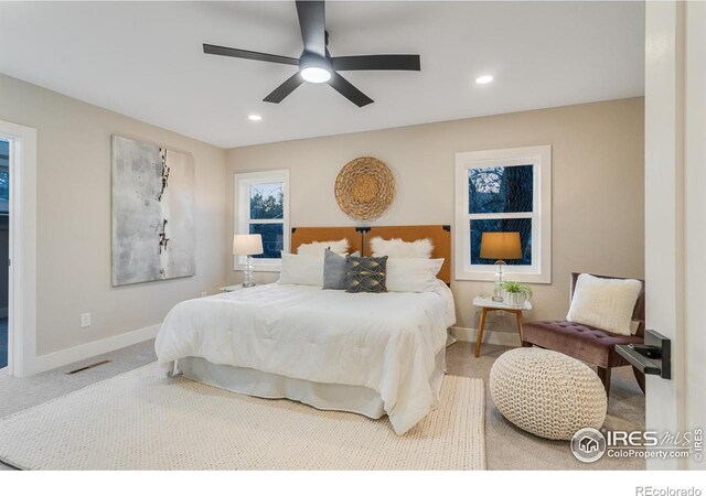 bedroom with ceiling fan and carpet