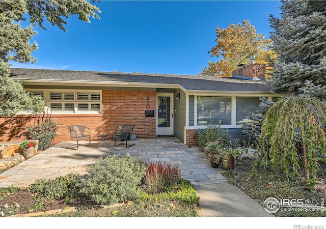 view of front of home featuring a patio area