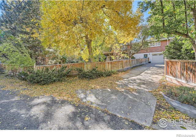 view of yard with a garage