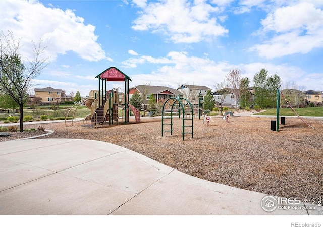 community jungle gym featuring a residential view
