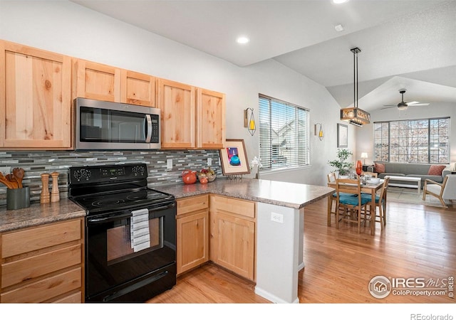 kitchen with black / electric stove, light brown cabinetry, stainless steel microwave, open floor plan, and light wood-style flooring