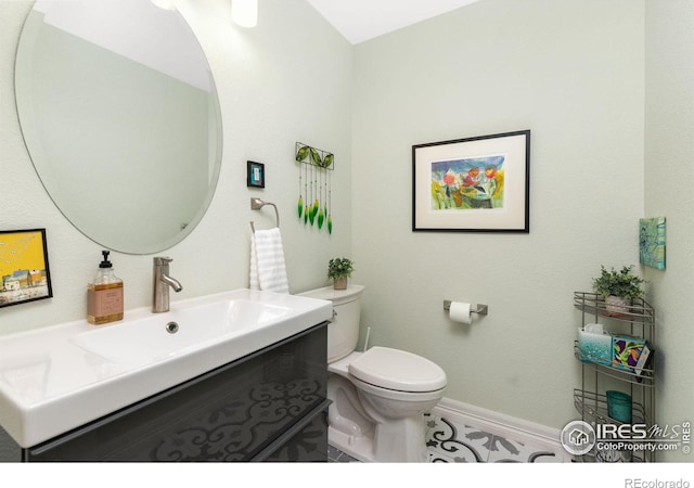 bathroom with vanity and toilet