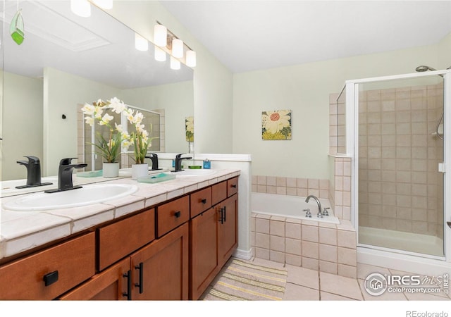 bathroom featuring vanity, tile patterned floors, and shower with separate bathtub