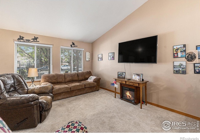 carpeted living room featuring lofted ceiling