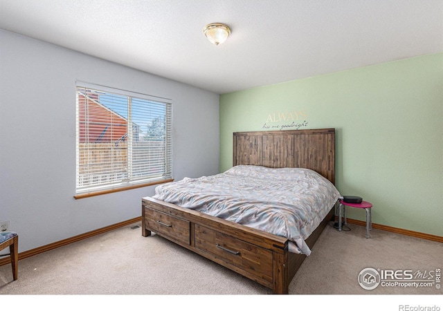 bedroom with light colored carpet