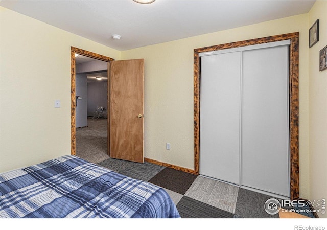 carpeted bedroom with a closet