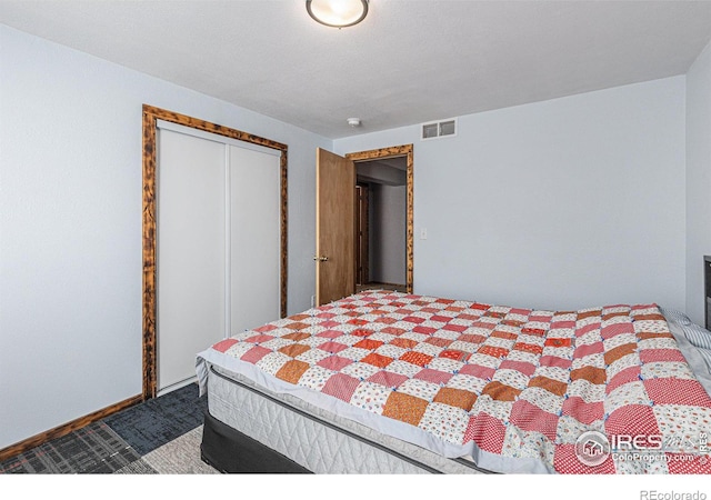 carpeted bedroom featuring a closet