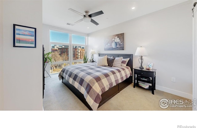 carpeted bedroom with ceiling fan