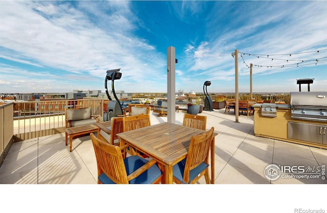 view of patio featuring exterior kitchen and area for grilling