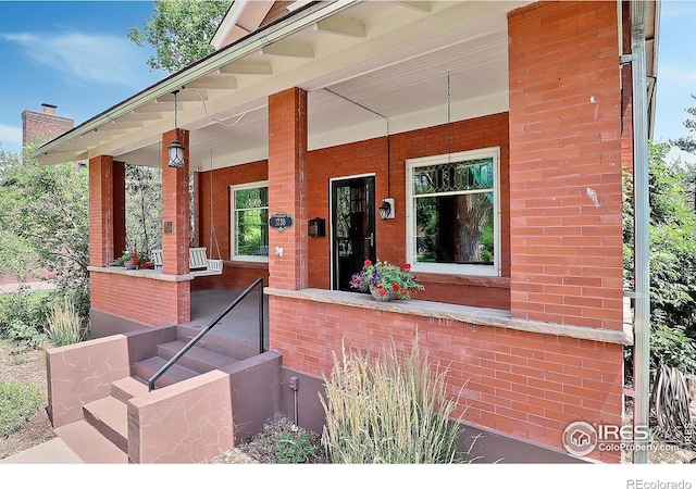 property entrance featuring covered porch