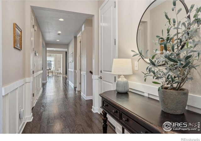 hallway featuring dark hardwood / wood-style flooring