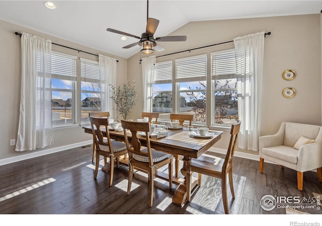 dining space featuring dark wood-type flooring, ceiling fan, and vaulted ceiling