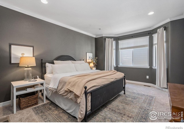 carpeted bedroom featuring ornamental molding