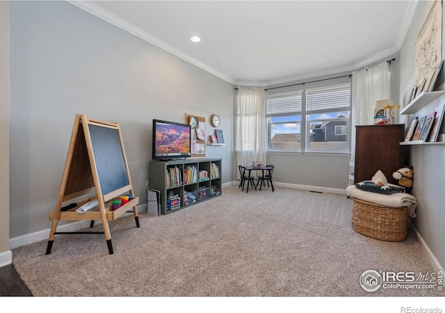 rec room with ornamental molding and carpet floors