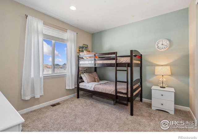 bedroom featuring light colored carpet