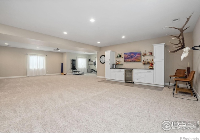 interior space with indoor bar and beverage cooler