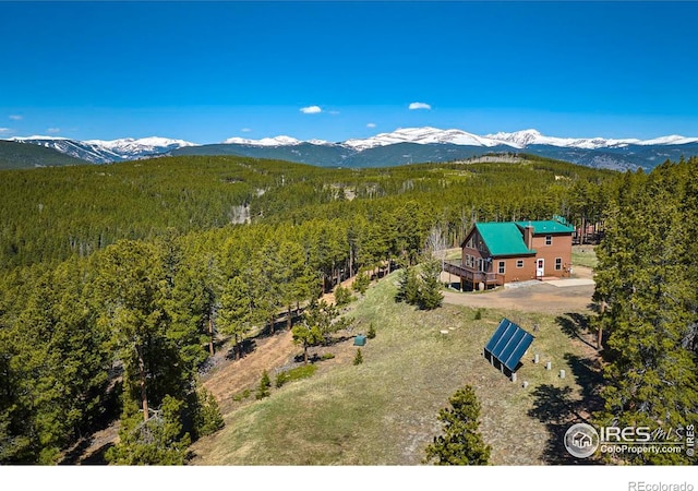 bird's eye view with a mountain view and a view of trees