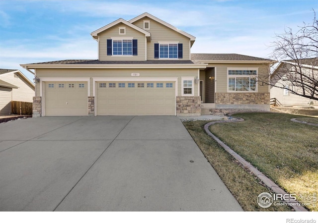 view of front of house with an attached garage, stone siding, a front lawn, and concrete driveway