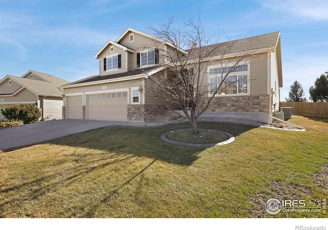 view of front of house with an attached garage, stone siding, a front lawn, and concrete driveway