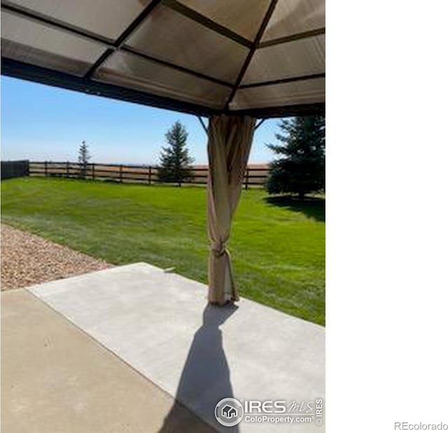 view of patio featuring a fenced backyard and a gazebo