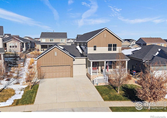 traditional-style house with a residential view, covered porch, board and batten siding, and driveway