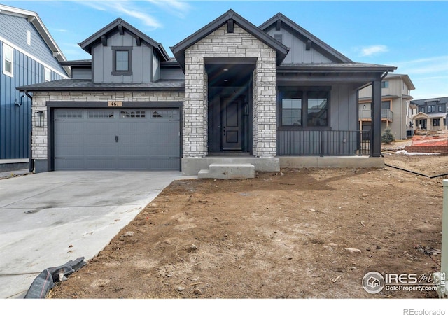 view of front of home with a garage and covered porch