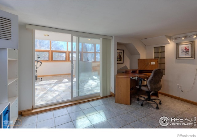 home office with tile patterned floors and baseboards