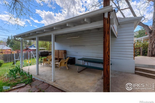 view of patio with fence