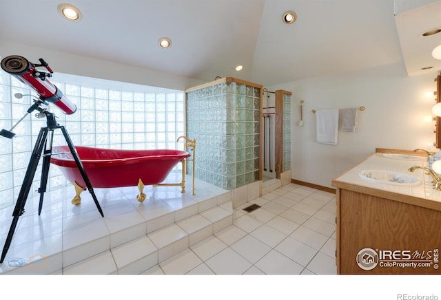 full bathroom with recessed lighting, tile patterned flooring, visible vents, a sink, and a soaking tub