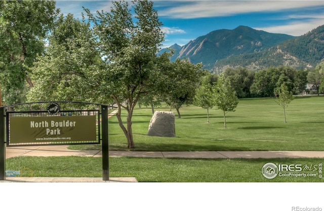 view of home's community featuring a yard and a mountain view